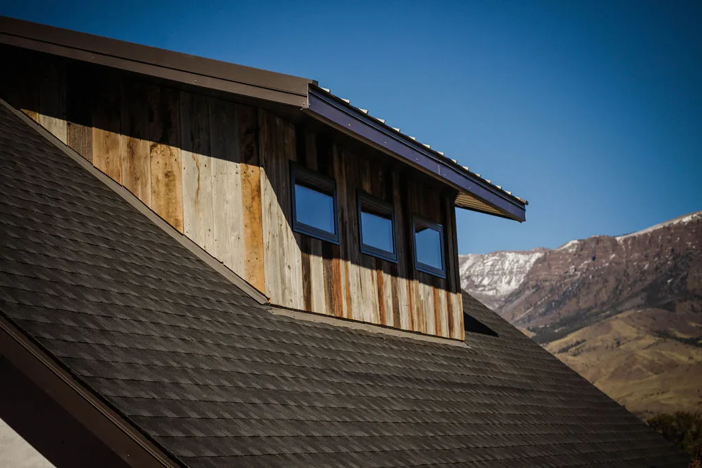 Reclaimed barnwood siding dormer with mountain views