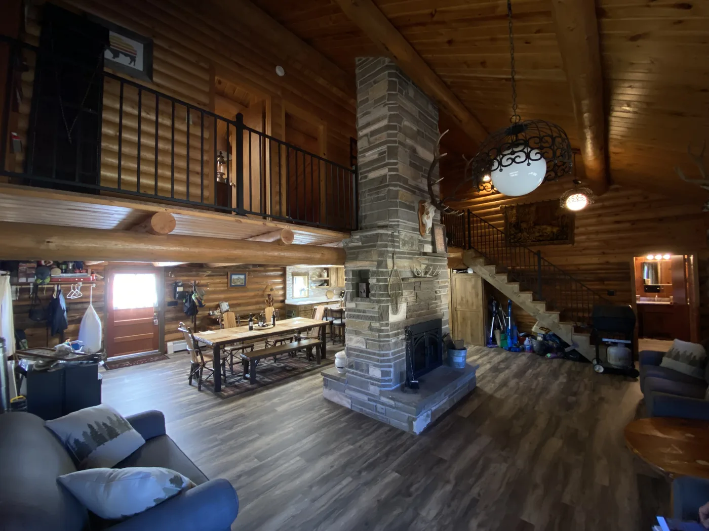 Stone fireplace with log loft and vaulted ceiling