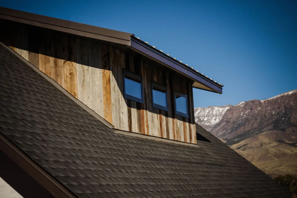 Barnwood dormer detail with mountain views showing custom craftsmanship