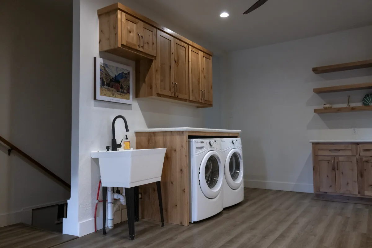 Laundry room renovation with custom cabinets by Pilot Peak Construction