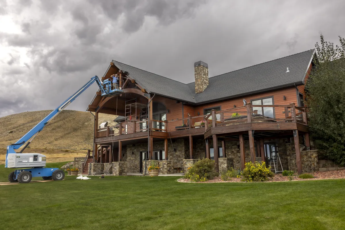 Exterior staining on large mountain home by Pilot Peak Construction